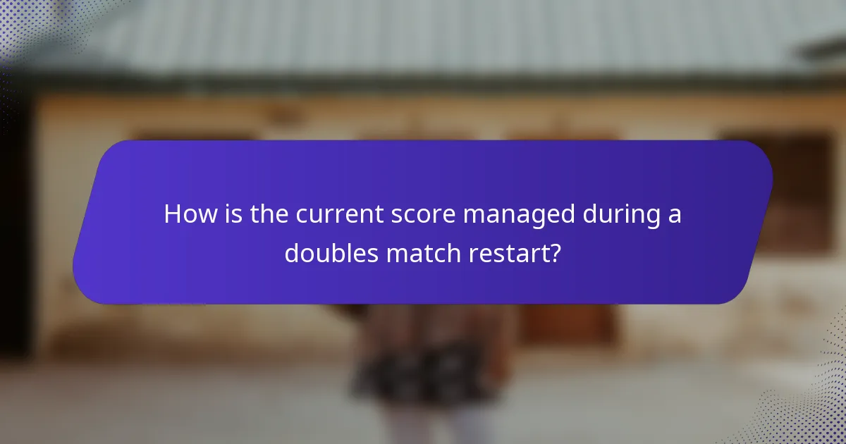 How is the current score managed during a doubles match restart?